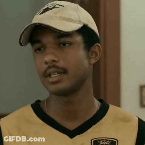 A Young Man Wearing A Hat That Says ' All You Hawk ' On It GIF