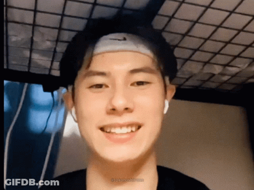 A Young Man Wearing A Headband With The Nike Logo On It GIF