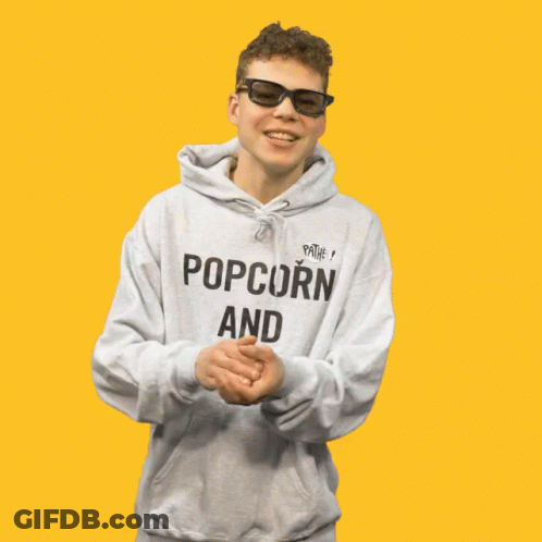 A Young Man Wearing A Hoodie That Says Popcorn And Chill GIF