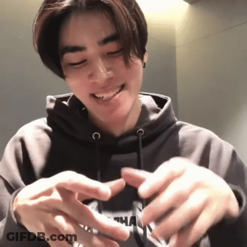 A Young Man Wearing A Hoodie With The Letter N On It GIF