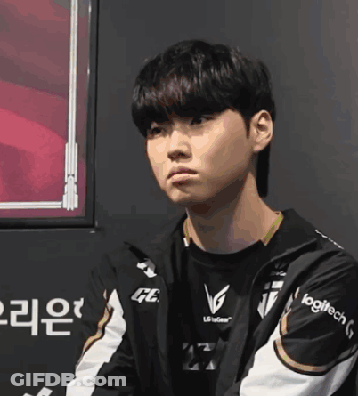 A Young Man Wearing A Jacket That Says Logitech On The Sleeve GIF