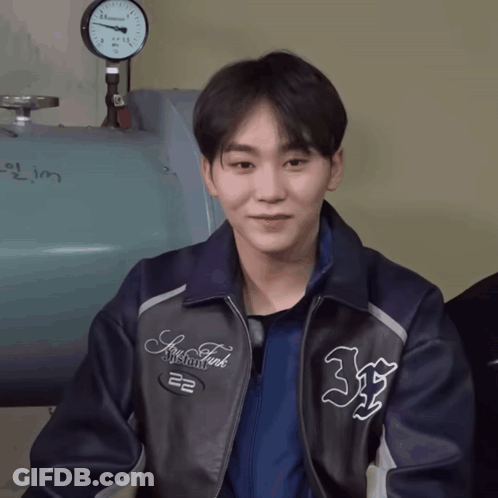 A Young Man Wearing A Jacket That Says New York GIF