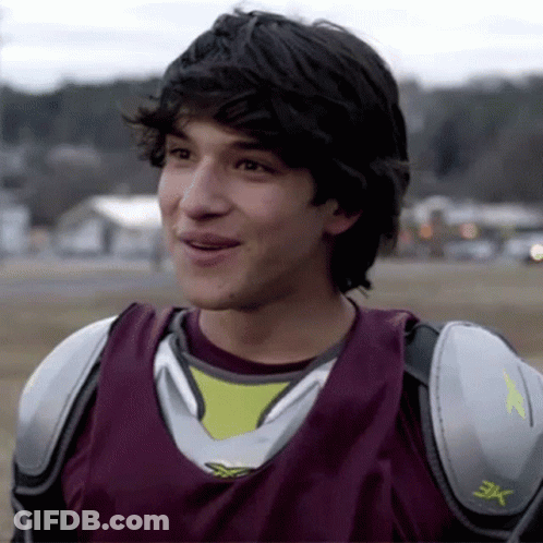 A Young Man Wearing A Jersey That Has The Letter X On It GIF