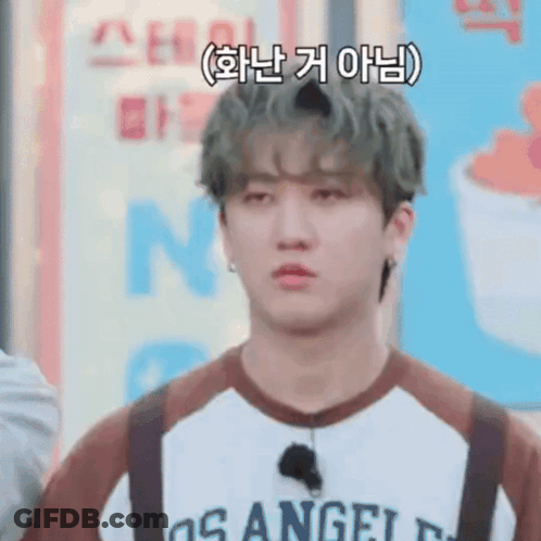 A Young Man Wearing A Los Angeles Shirt And Suspenders Is Making A Sad Face . GIF