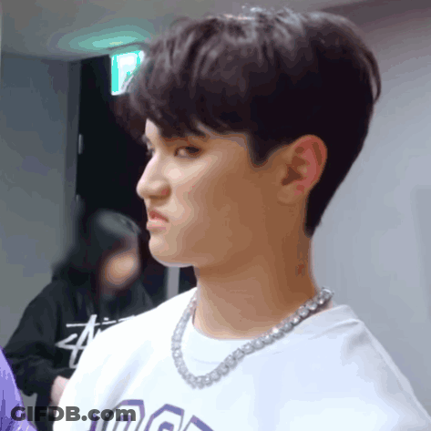 A Young Man Wearing A Necklace And A T-Shirt That Says ' A ' On It GIF