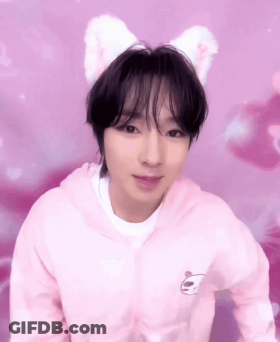 A Young Man Wearing A Pink Hoodie With A Panda On It GIF