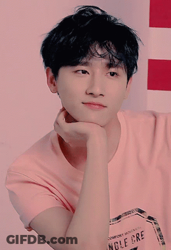A Young Man Wearing A Pink T-Shirt That Says Comfort Moments Angle Cre GIF