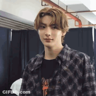 Young Man Making Funny Face In Plaid And Black T-Shirt GIF