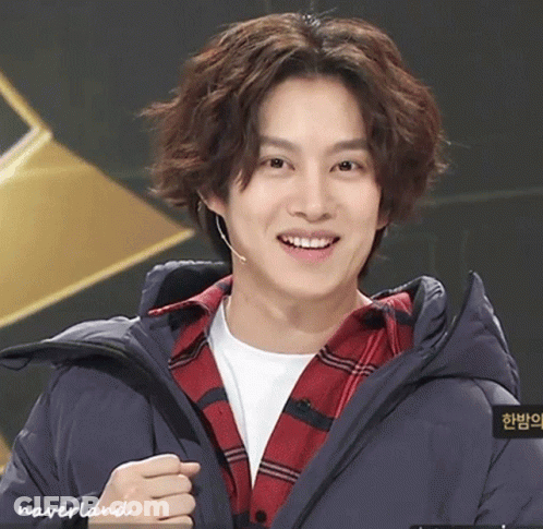 A Young Man Wearing A Plaid Shirt And A Blue Jacket Has Neverland Written On The Bottom Of His Jacket GIF