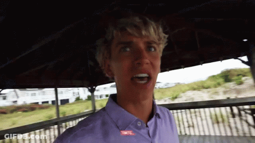 A Young Man Wearing A Purple Shirt With The Word Tnt On It GIF