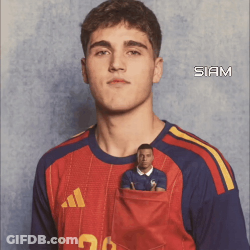 A Young Man Wearing A Red Adidas Shirt With A Smaller Man In His Pocket GIF