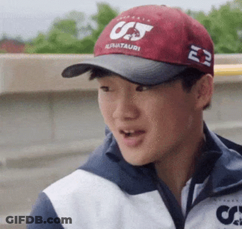 A Young Man Wearing A Red Hat That Says Cj On It GIF