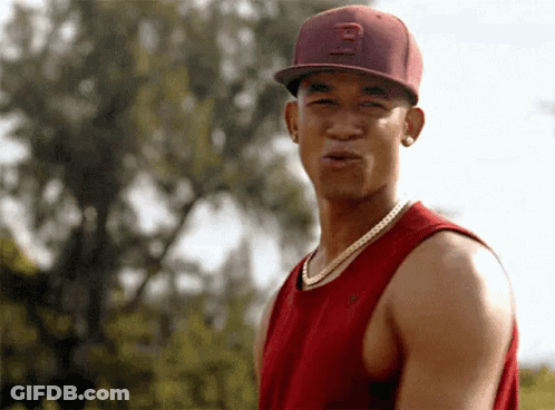 A Young Man Wearing A Red Hat With The Letter B On It GIF