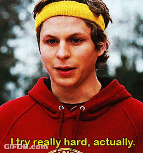 A Young Man Wearing A Red Hoodie And A Yellow Headband Says " I Try Really Hard Actually " GIF