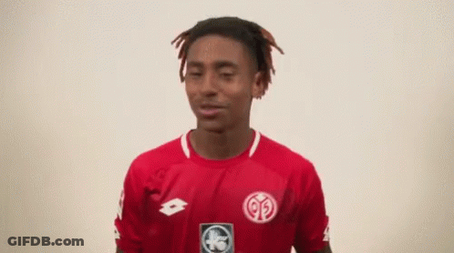 A Young Man Wearing A Red Shirt That Says Lotto GIF