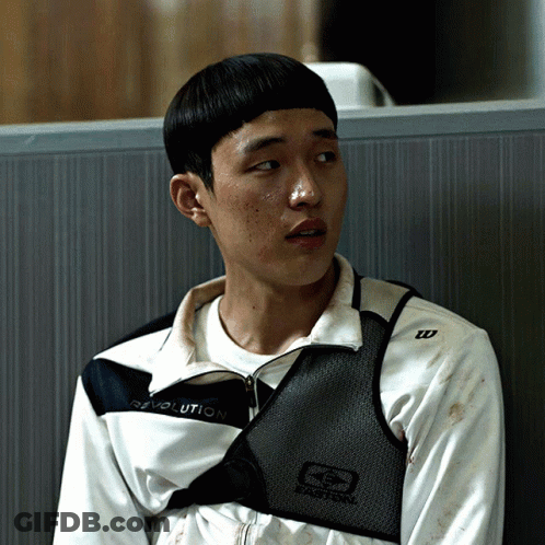 A Young Man Wearing A Revolution Jacket Sits In A Cubicle GIF