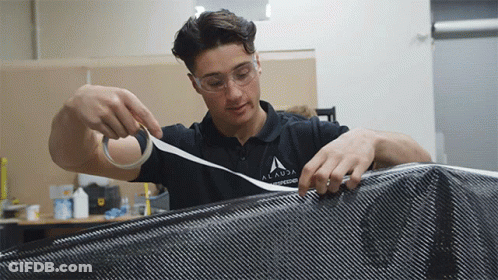 A Young Man Wearing A Shirt That Says Alanda Engineering GIF