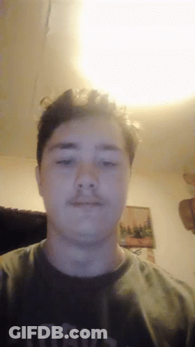 A Young Man Wearing A Shirt That Says Always Looks At The Camera GIF