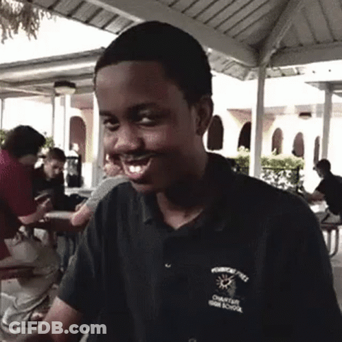 A Young Man Wearing A Shirt That Says Charter High School On It GIF