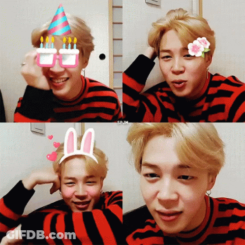 A Young Man Wearing A Striped Shirt And Bunny Ears GIF
