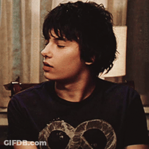 A Young Man Wearing A T-Shirt With A Skull On It GIF
