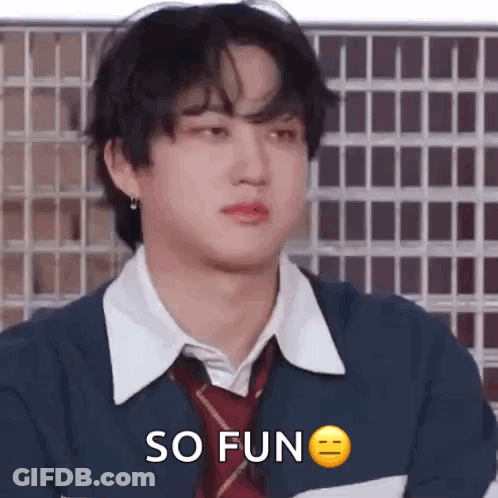 A Young Man Wearing A Tie And A Jacket Is Making A Funny Face And Saying `` So Fun '' . GIF