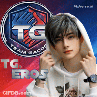 A Young Man Wearing A White Hoodie Stands In Front Of A Tg Team Gacor Logo GIF