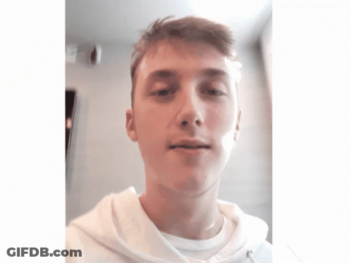 A Young Man Wearing A White Shirt And A White Hoodie GIF