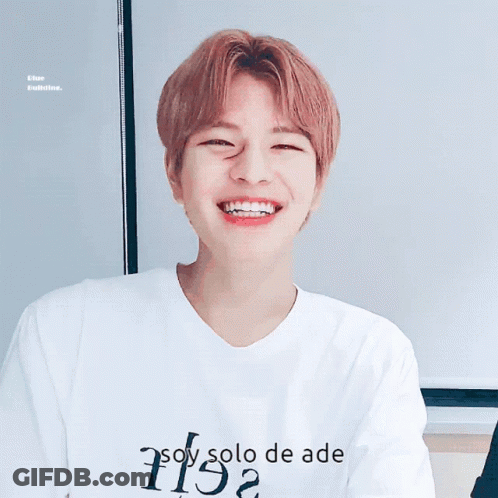 A Young Man Wearing A White Shirt That Says " Soy Solo De Ade " GIF