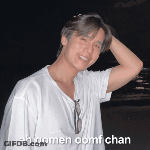 A Young Man Wearing A White Shirt With The Words Ah Gomen Oomf Chan On The Bottom Right GIF
