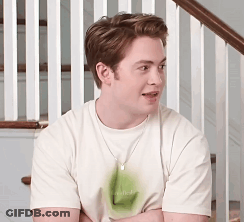 A Young Man Wearing A White T-Shirt That Says Real Fresh GIF