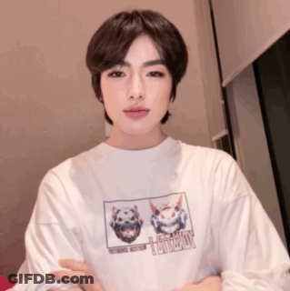 A Young Man Wearing A White T-Shirt With A Picture Of A Cat And A Dog On It GIF