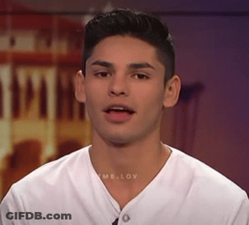 A Young Man Wearing A White T-Shirt With The Word Love On The Front GIF