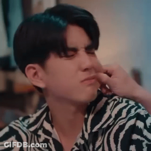 A Young Man Wearing A Zebra Print Shirt Is Holding His Nose . GIF