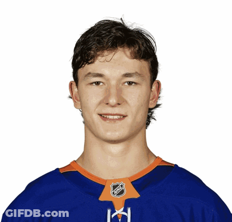 A Young Man Wearing An Nhl Jersey Is Smiling GIF