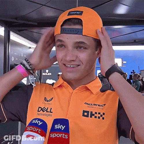 A Young Man Wearing An Orange Shirt That Says Dell Technologies On It GIF