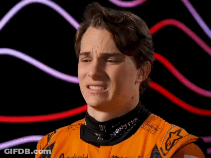 A Young Man Wearing An Orange Shirt With The Word Monster On The Collar GIF