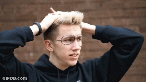 Young Man With Glasses And Black Hoodie Holding Head GIF