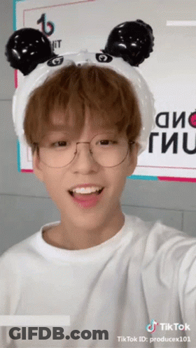 A Young Man Wearing Glasses And A Headband With Panda Ears Has A Tiktok Id Of Producex101 GIF