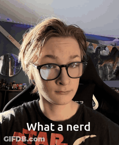 A Young Man Wearing Glasses And A Star Wars Shirt Says " What A Nerd " GIF