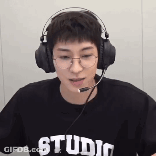 A Young Man Wearing Glasses And Headphones With The Word Studio On His T-Shirt GIF