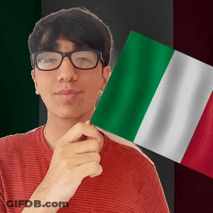 A Young Man Wearing Glasses Holds A Green White And Red Flag GIF