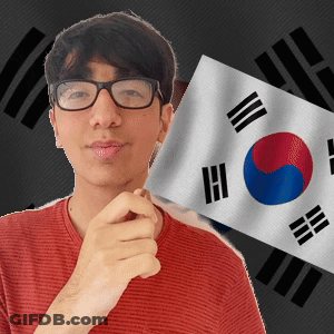 A Young Man Wearing Glasses Holds A Korean Flag GIF
