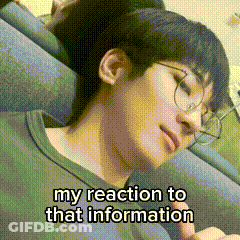 A Young Man Wearing Glasses Is Laying On A Couch With His Eyes Closed . GIF