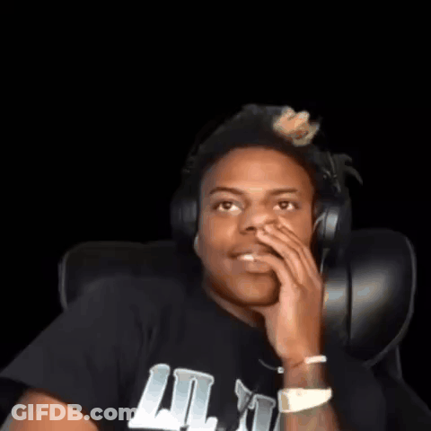 A Young Man Wearing Headphones And A Black Shirt Is Sitting In A Chair . GIF