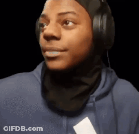 A Young Man Wearing Headphones And A Blue Hoodie Is Making A Face . GIF