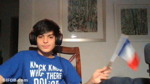 A Young Man Wearing Headphones And A Blue Shirt That Says Knock Know Who There Dolor GIF
