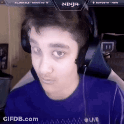 A Young Man Wearing Headphones And A Blue Shirt With The Word Ninja On The Screen . GIF