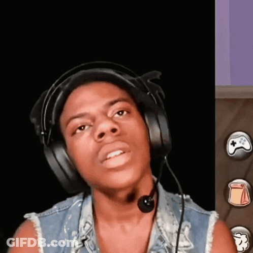 A Young Man Wearing Headphones And A Microphone Is Looking At The Camera GIF