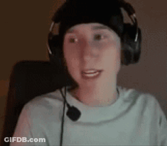 A Young Man Wearing Headphones And A Microphone Is Sitting In A Chair . GIF